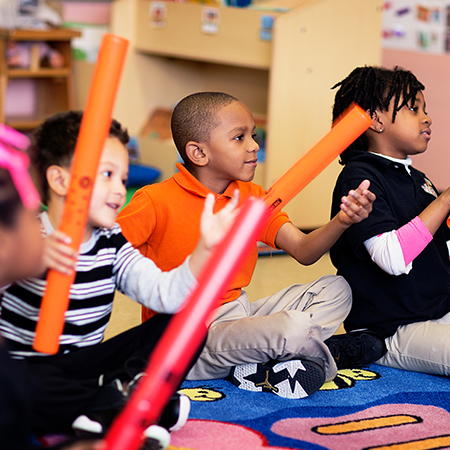 children playing with boomwhackers