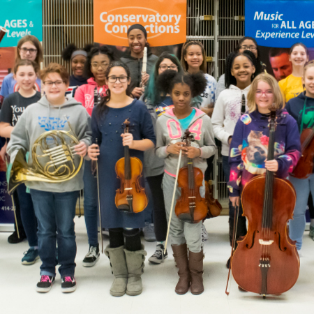 students holding instruments