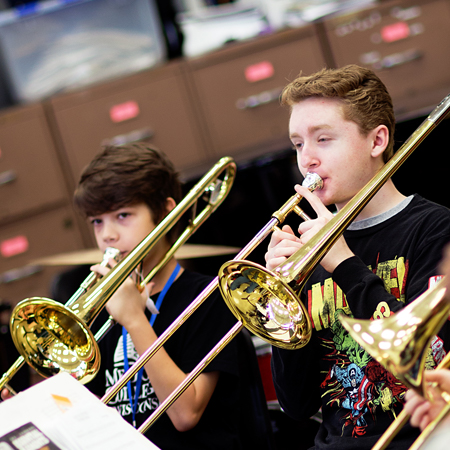 boys playing trombones