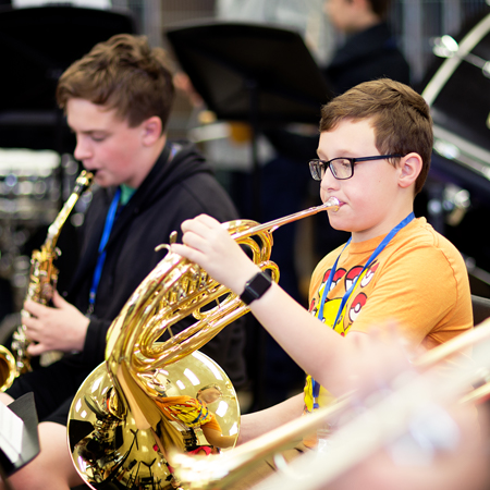 boys playing horns
