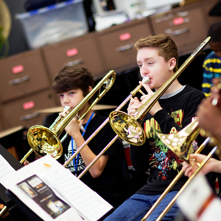 boys playing trombone